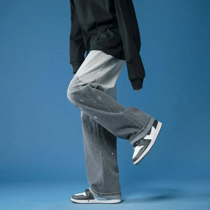 Comfortable unisex wide-leg jeans with a unique bleach-dye effect and stylish fade, perfect for a relaxed fit.