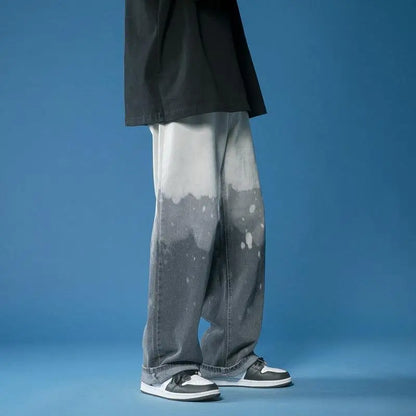 Model showcasing unisex wide-leg fade jeans with a bold bleach-dye design, highlighting a comfortable, relaxed fit.