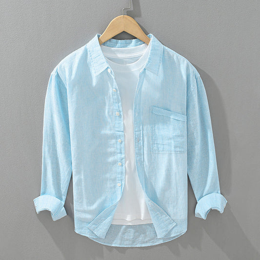 Unisex blue striped button-up shirt for casual everyday comfort and versatile summer wear.