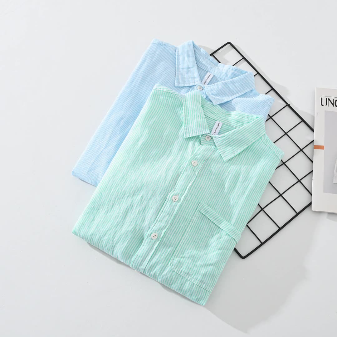 Casual striped button-up shirt in blue for men & women, ideal for comfortable summer outfits.