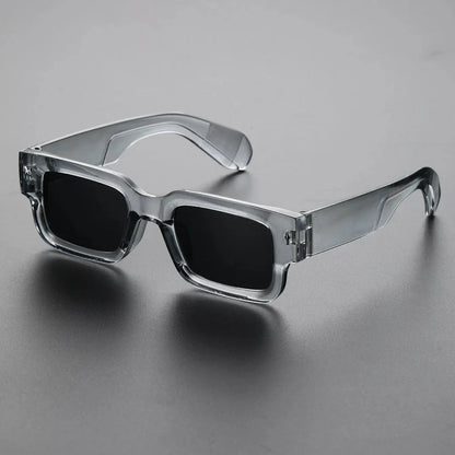 Unisex bold rectangular sunglasses with UV protection. Black translucent frames, lightweight fashion eyewear for any look.