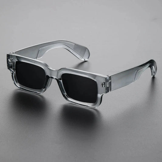 Unisex bold rectangular sunglasses with UV protection. Black translucent frames, lightweight fashion eyewear for any look.