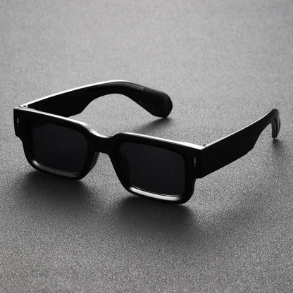 Black translucent rectangular shades offering UV protection. Lightweight unisex eyewear, perfect bold fashion accessory.