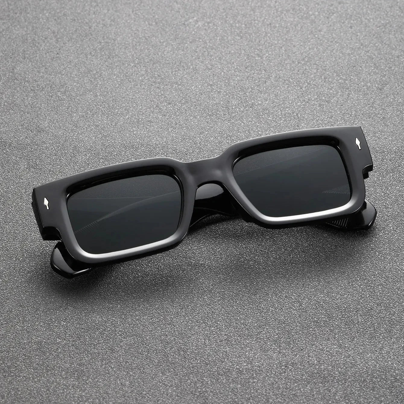 Unisex rectangular UV protection sunglasses with bold black translucent frames. Stylish and lightweight fashion eyewear.