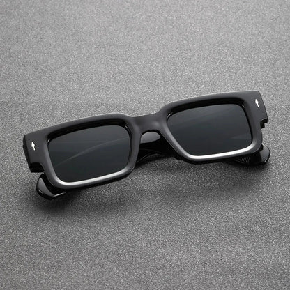Unisex rectangular UV protection sunglasses with bold black translucent frames. Stylish and lightweight fashion eyewear.