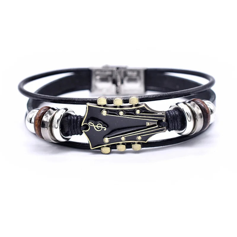 Unisex braided leather bracelet with a detailed silver guitar charm, perfect music lover's jewelry accessory.