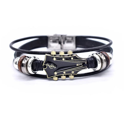 Unisex braided leather bracelet with a detailed silver guitar charm, perfect music lover's jewelry accessory.