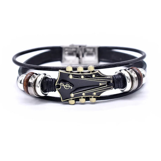 Unisex braided leather bracelet with a detailed silver guitar charm, perfect music lover's jewelry accessory.