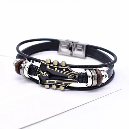 Stylish unisex guitar leather bracelet worn on a wrist, a trendy music jewelry accessory for everyday wear.