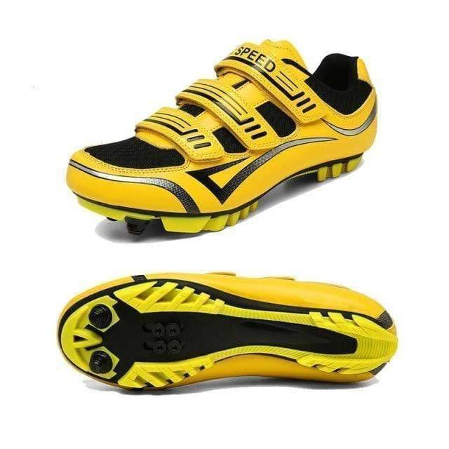 Pair of unisex cycling shoes, black and white, suitable for both road and mountain biking