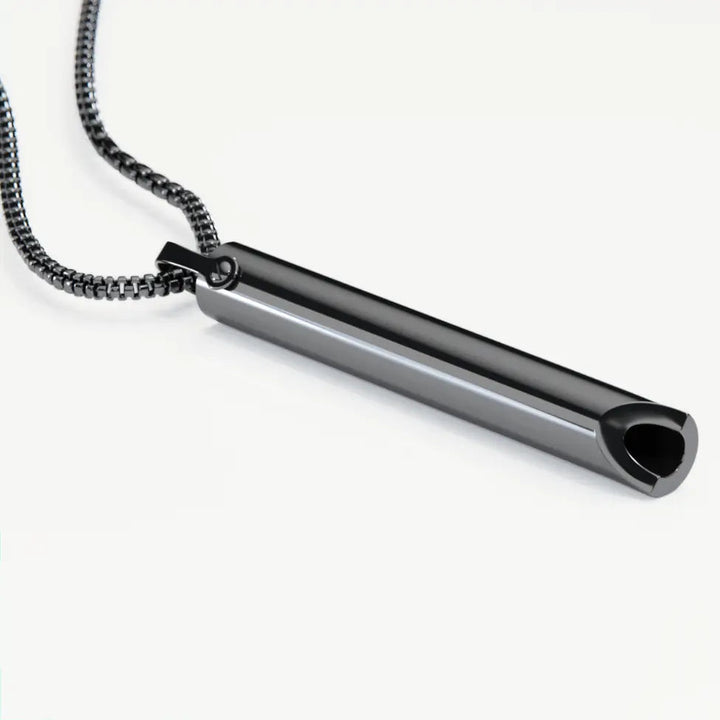Sleek metallic breathing pendant, a mindfulness tool for calm & anxiety support.