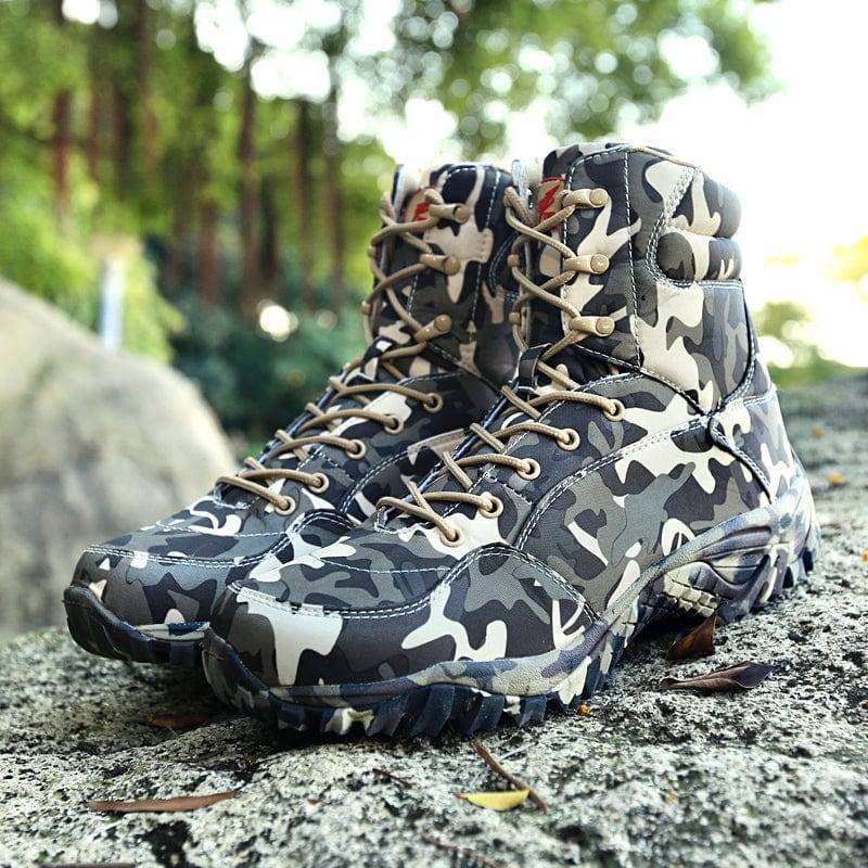 Close-up of camouflage canvas trekking boots, unisex outdoor footwear with sturdy laces for hiking
