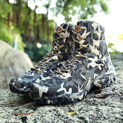 Close-up of camouflage canvas trekking boots, unisex outdoor footwear with sturdy laces for hiking