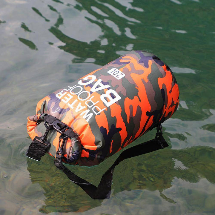 Fully sealed camouflage dry bag backpack, protecting gear from water for hiking and kayaking.