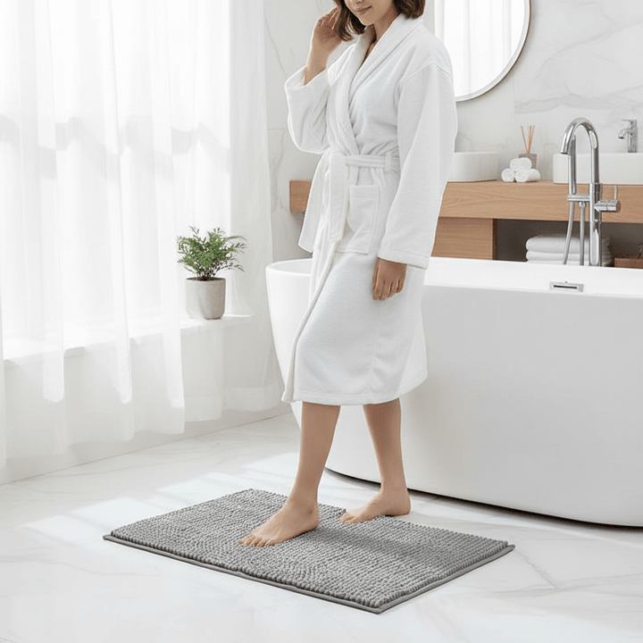 Soft chenille bath rug, absorbent and non-slip, perfect for bathroom floor safety.