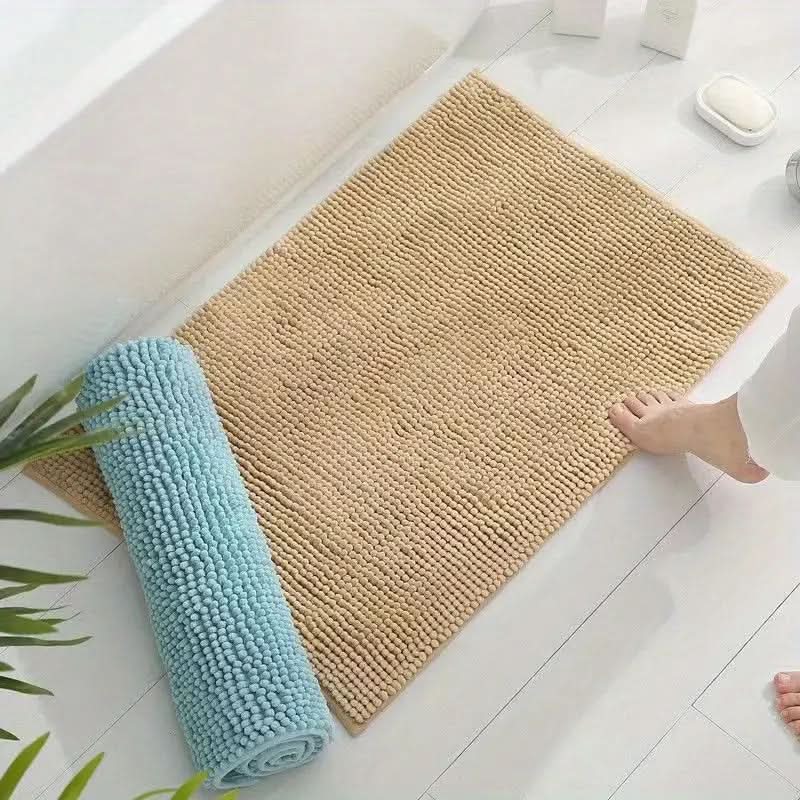 Stylish chenille bathroom rug, absorbent & non-slip, enhances home decor and ensures safety.
