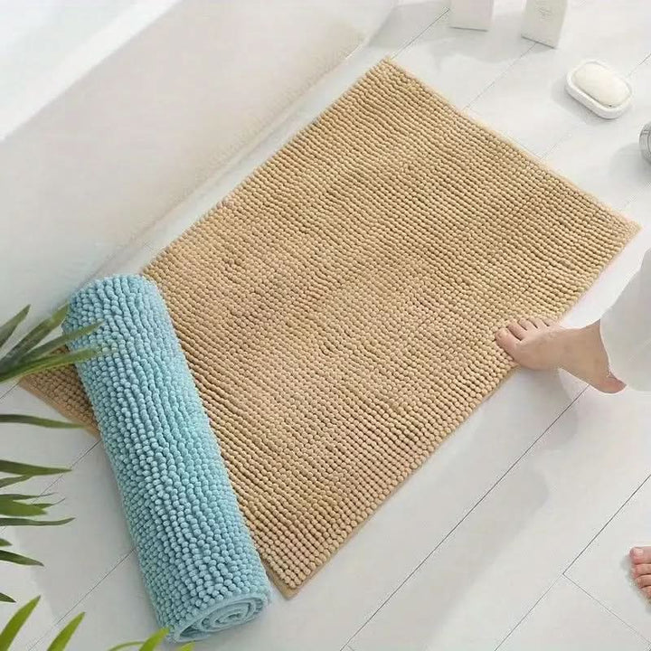 Stylish chenille bathroom rug, absorbent & non-slip, enhances home decor and ensures safety.