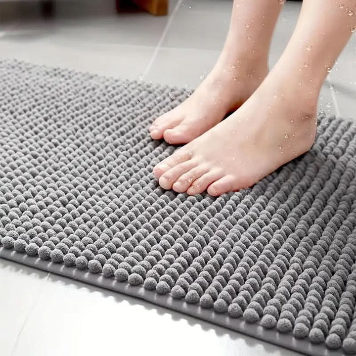 Unisex absorbent chenille floor mat with non-slip backing, ideal for any bathroom, soft underfoot.