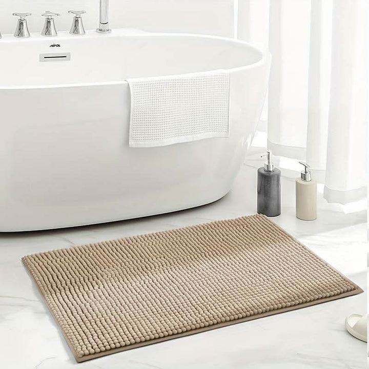 Secure non-slip chenille bath mat, soft and highly absorbent, essential for bathroom safety & comfort.