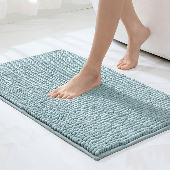 Soft chenille bathroom mat with non-slip backing, great for absorbing water & preventing slips.