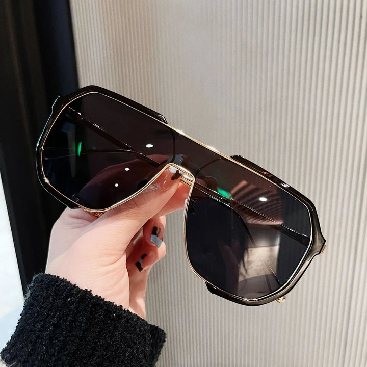 Unisex classic aviator sunglasses with sleek silver metal frame & dark tinted lenses.