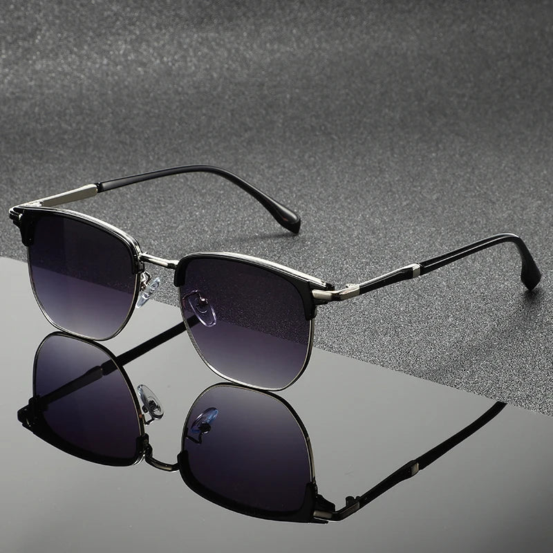 Gray Clubmaster sunglasses with full UV protection. Unisex, scratch-resistant, stylish eyewear for sun protection.