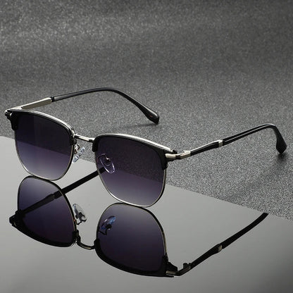 Gray Clubmaster sunglasses with full UV protection. Unisex, scratch-resistant, stylish eyewear for sun protection.