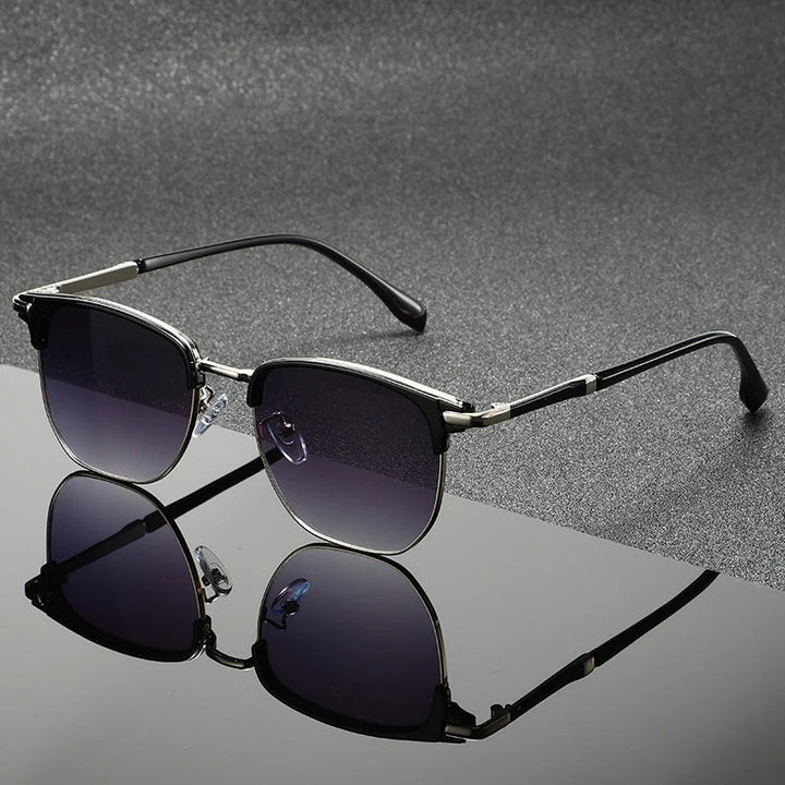 Gray Clubmaster sunglasses with full UV protection. Unisex, scratch-resistant, stylish eyewear for sun protection.