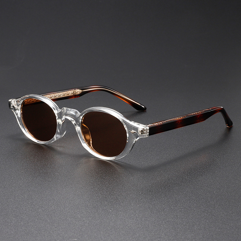 Stylish unisex retro sunglasses with UV400 protection. Classic oval design & dark tint, perfect fashion accessory.