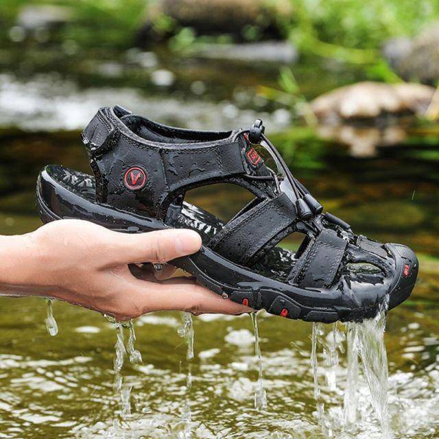 Leather hiking sandals with closed toe design, providing protection and comfort for outdoor activities.