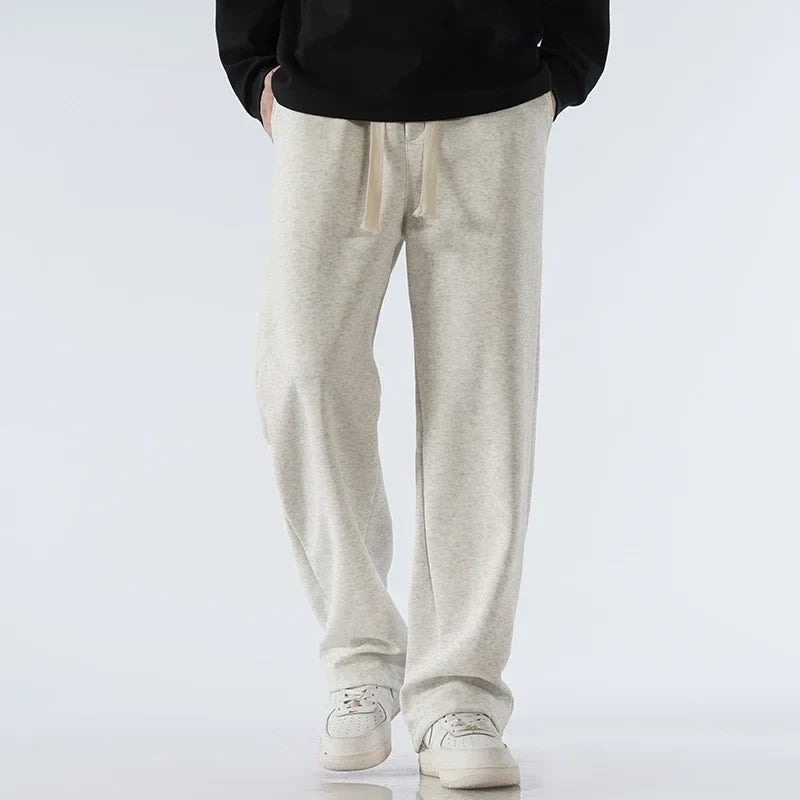 Relaxed fit athleisure wide-leg sweatpants with drawstring, perfect for versatile everyday wear.