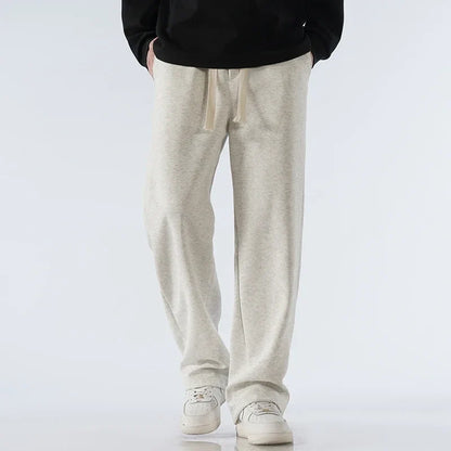 Relaxed fit athleisure wide-leg sweatpants with drawstring, perfect for versatile everyday wear.