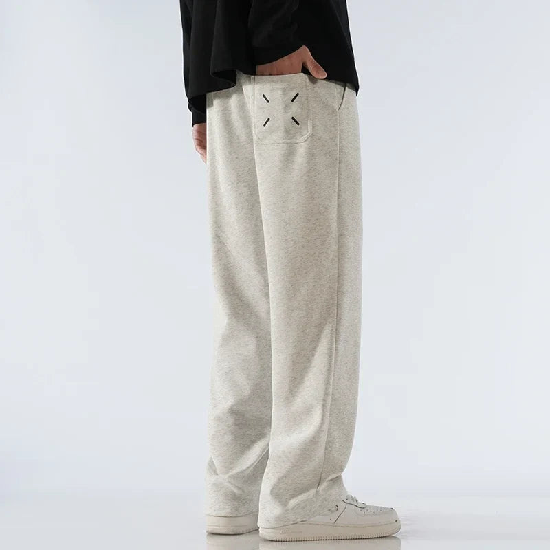 Drawstring wide-leg sweatpants, offering everyday comfort & versatile athleisure style for all.