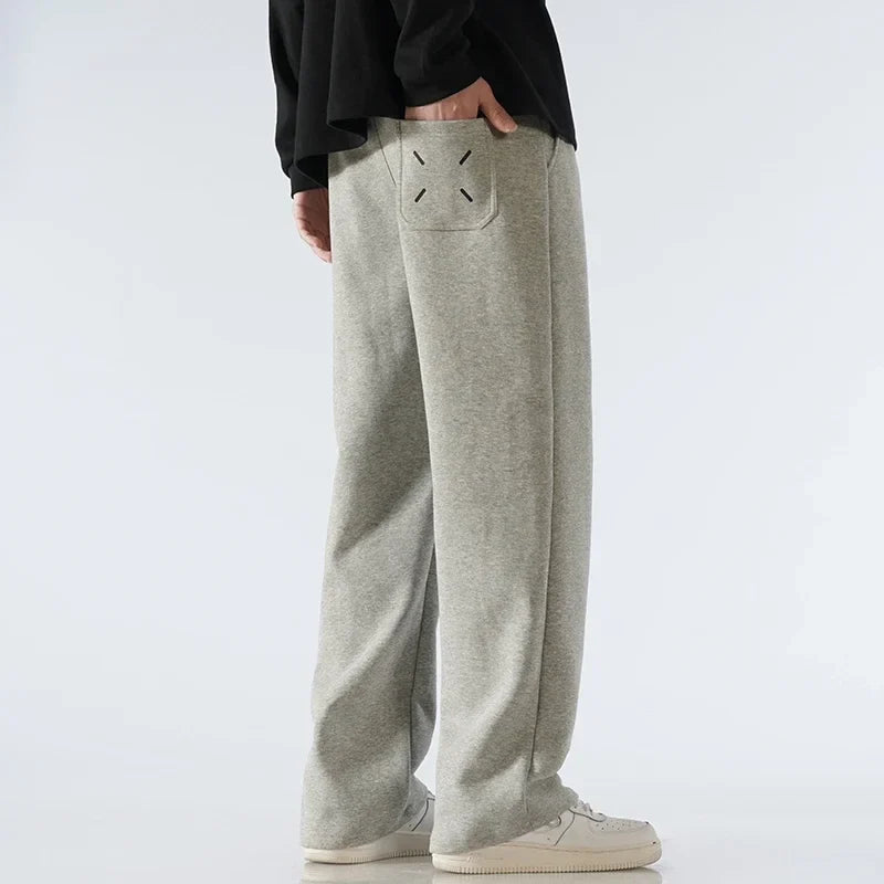Relaxed fit wide-leg sweatpants, essential comfort wear with a versatile athleisure look.
