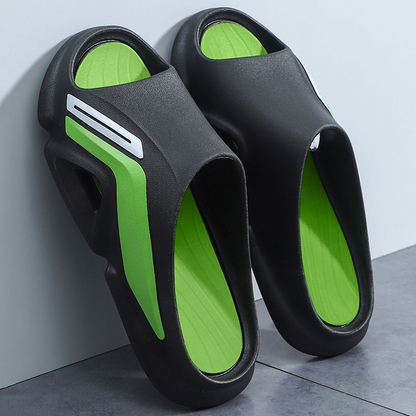 A pair of colorful unisex Cloud Cushion Slides, showcasing the soft EVA foam material and ergonomic design.