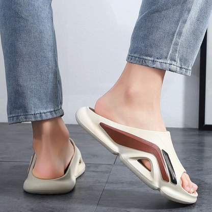 Close-up of textured sole on Cloud Cushion Slides, made from soft, cushioned EVA foam. Unisex comfort footwear.