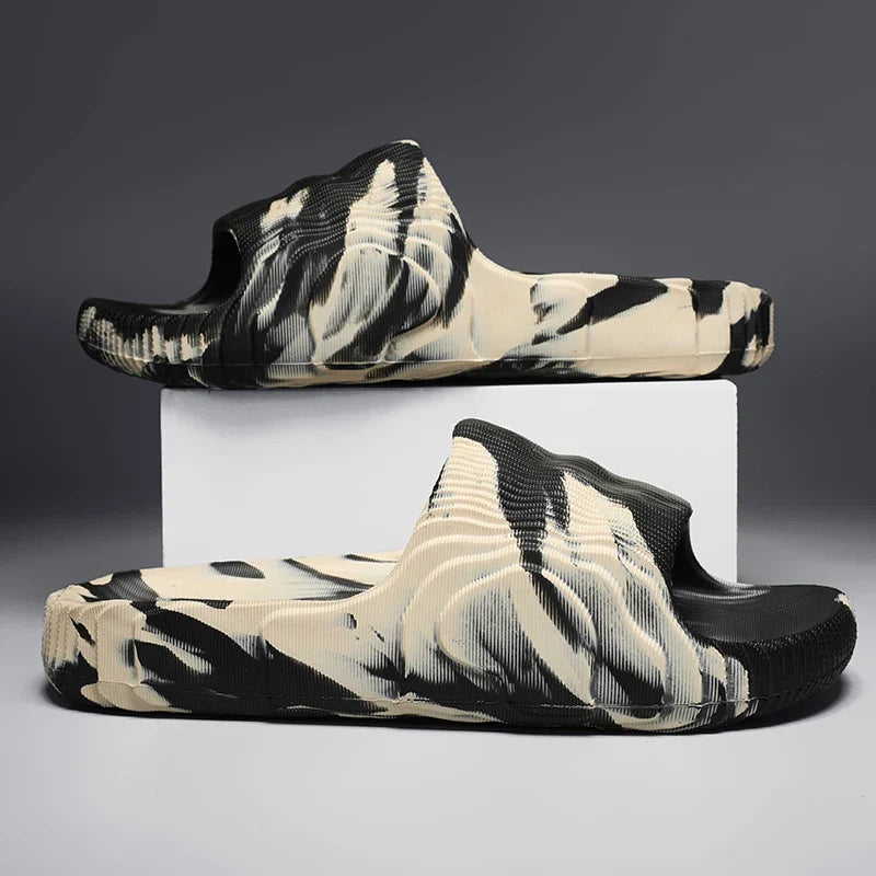 Unisex Cloud-Soft Rio slides, marbled design, cushioned for ultimate comfort. Perfect casual summer footwear.
