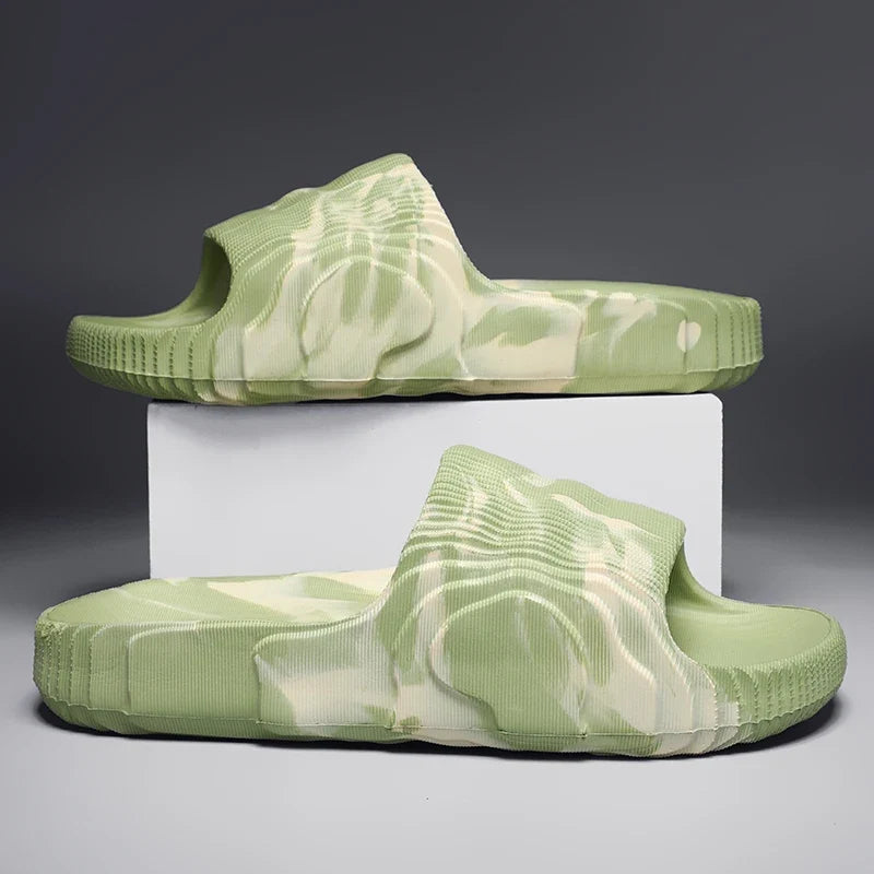Person wearing unisex Cloud-Soft Rio slides, comfortable open-toe footwear ideal for casual summer style.