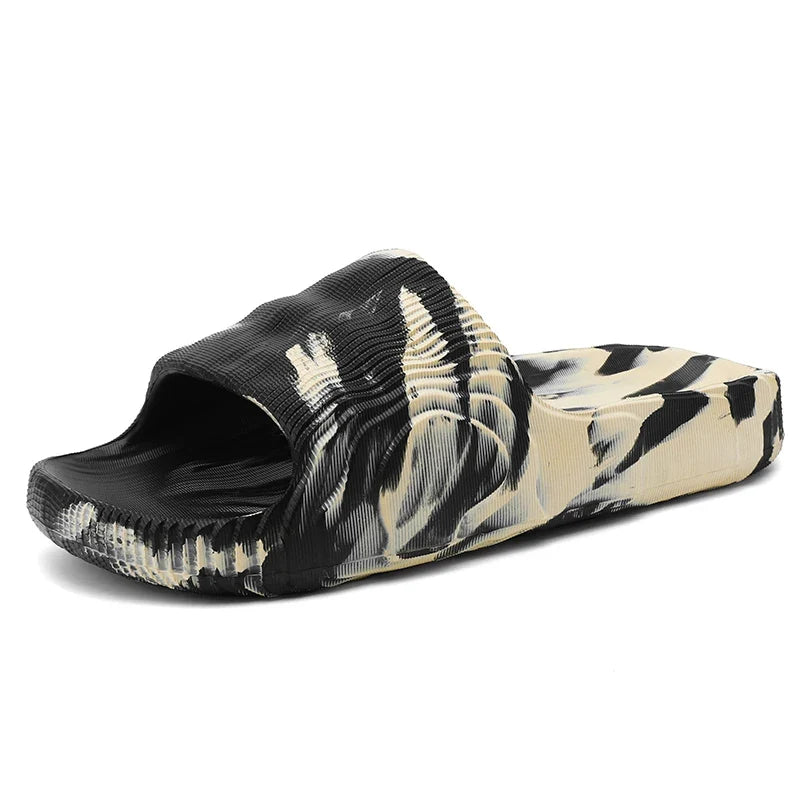 Stylish unisex Rio slides with unique marbled pattern, offering cloud-soft cushioning and casual summer comfort.