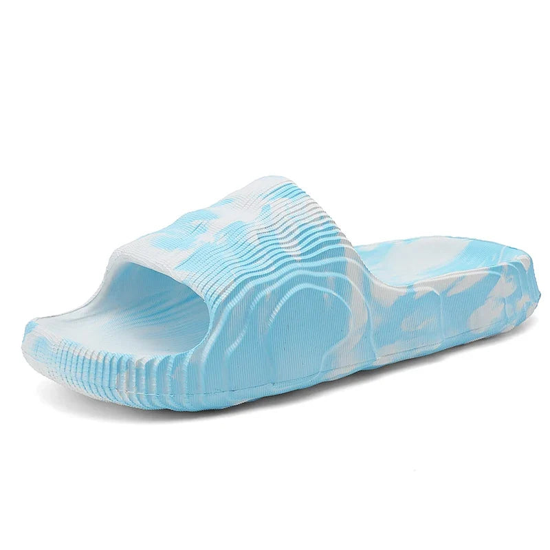 Ultra-comfortable Cloud-Soft Rio slides, unisex cushioned footwear with open-toe design, perfect for relaxation.