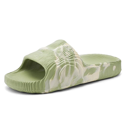 Pair of unisex Cloud-Soft Rio slides, marbled casual footwear with cushioned soles for ultimate summer comfort.