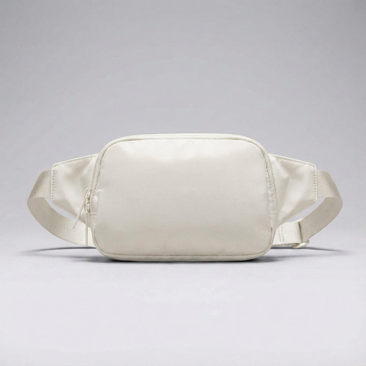 Crossbody nylon bag, compact and lightweight. Unisex hip pack for travel essentials and daily adventures.