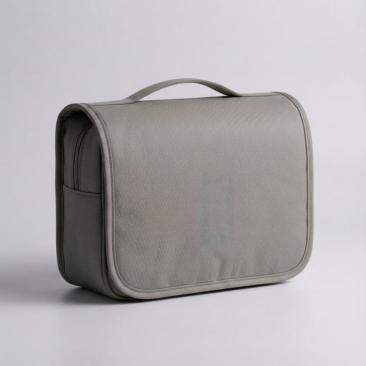 Neatly organized travel toiletry bag. Holds cosmetics, toiletries & essentials securely.