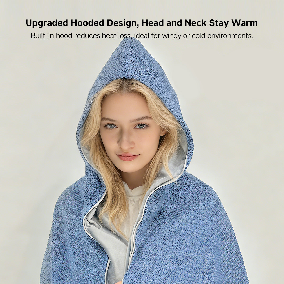 Woman wearing a portable cordless graphene heated shawl while working at an office desk