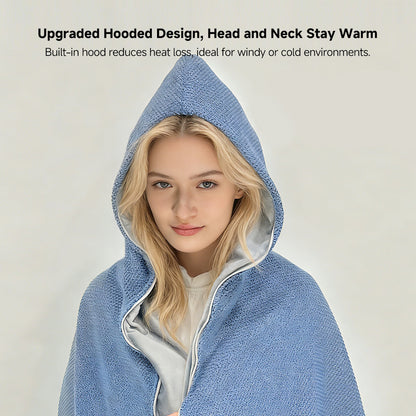 Woman wearing a portable cordless graphene heated shawl while working at an office desk
