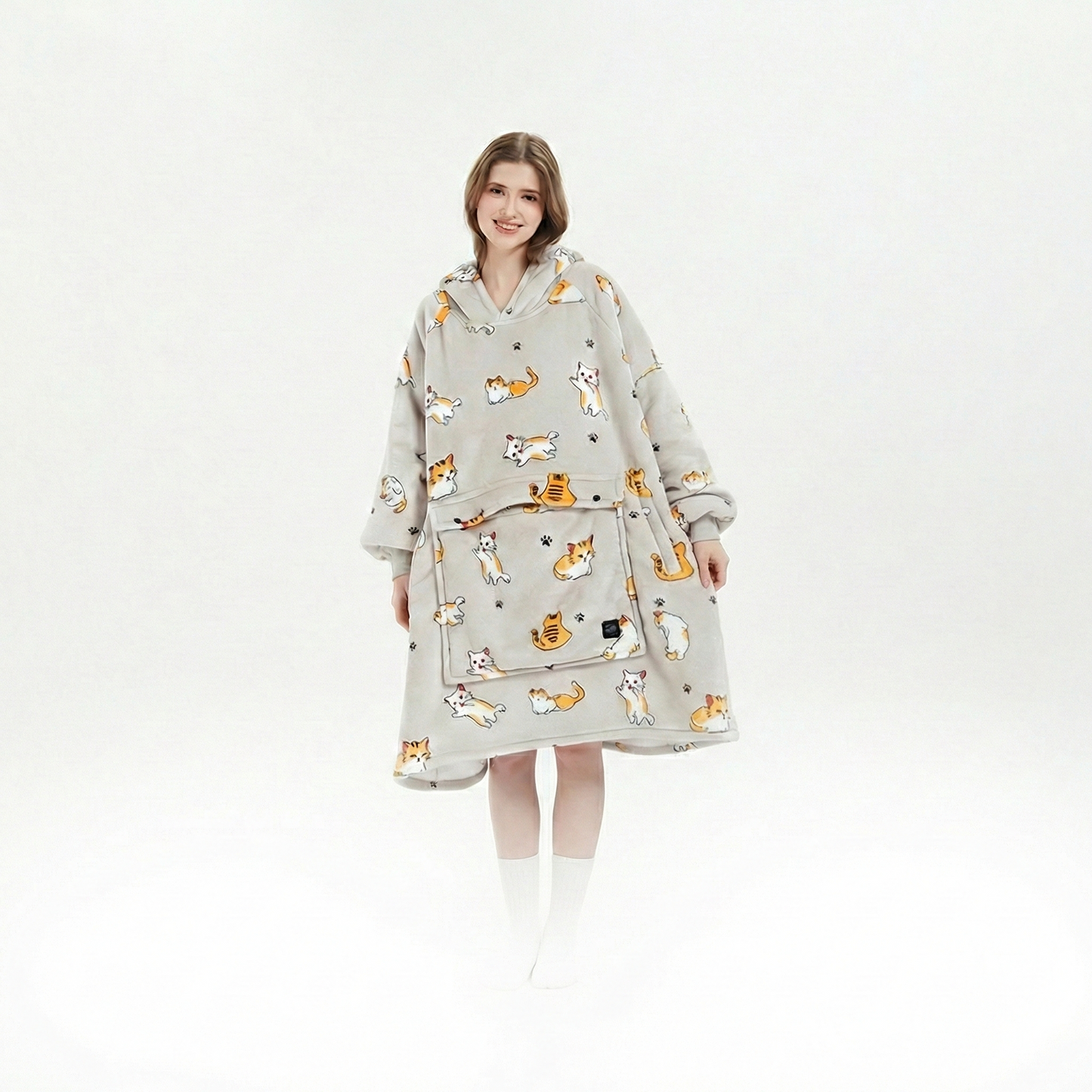 Unisex cordless heated flannel hoodie blanket draped over a chair, inviting coziness and warmth for any winter moment.