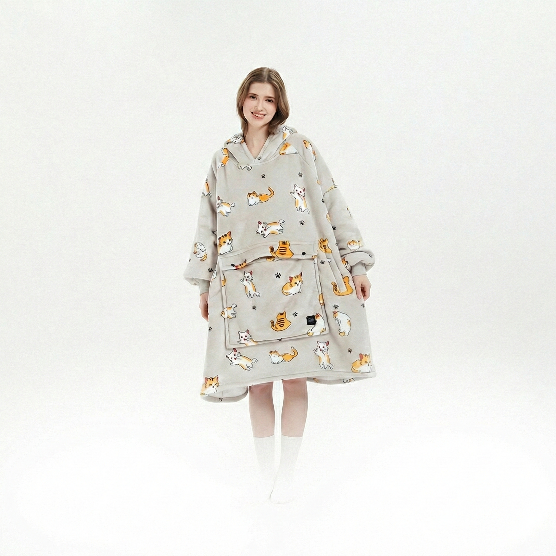 Unisex cordless heated flannel hoodie blanket draped over a chair, inviting coziness and warmth for any winter moment.