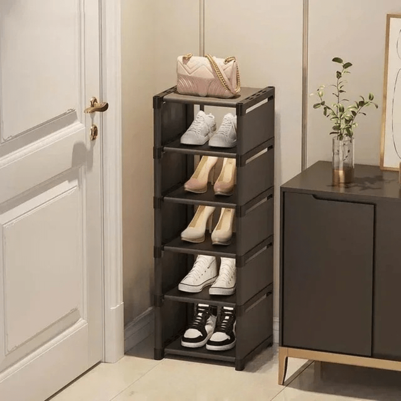 Corner shoe organizer in a small hallway, optimizing entryway space with smart compact storage for shoes.