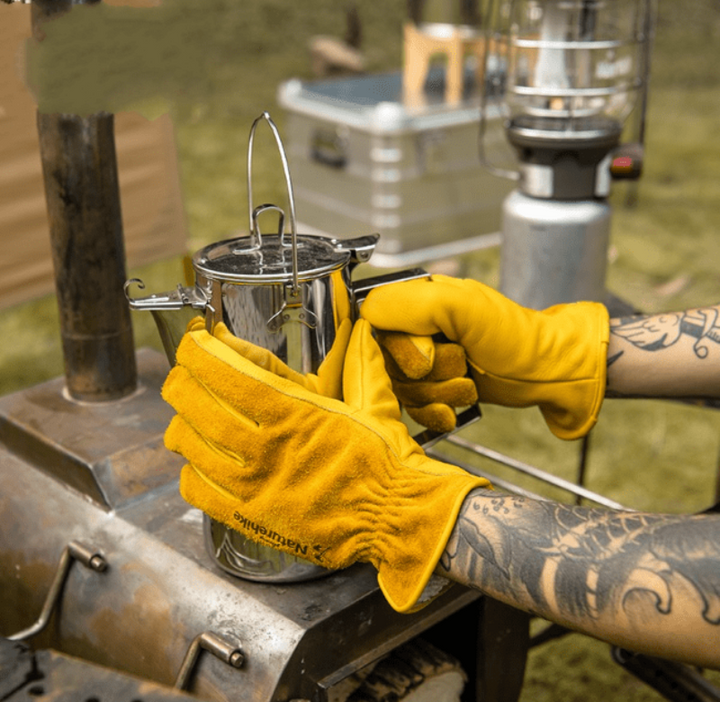 Unisex cowhide leather work gloves for heavy-duty protection in gardening and construction tasks.