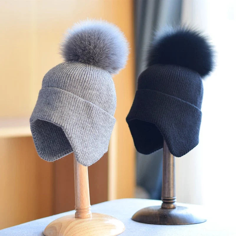 Unisex cozy alpine pom beanie. Warm winter hat, perfect for cold weather outdoor activities. Stylish headwear.